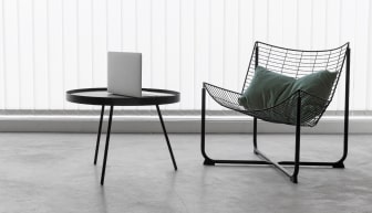 a room with a chair and a round table